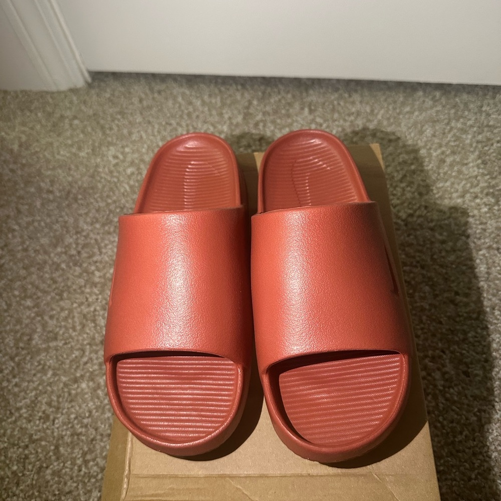 Nike Calm Slide Sandals in Red